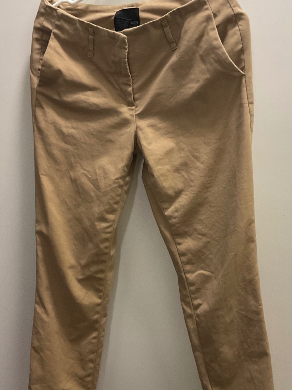beige cotton chino pants with a rolled hem